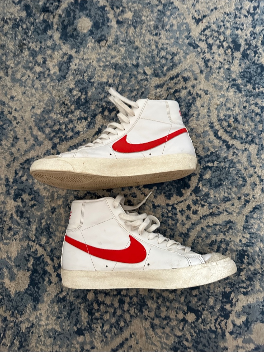 Nike White High-Top Sneakers with Red Swoosh Accent